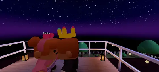 A kiss on the rooftop deck under the stars